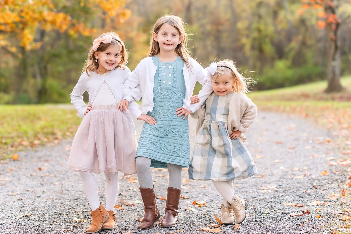 Three little girls in neutral colors in golden hour light with Cranberry Township, PA newborn photographer