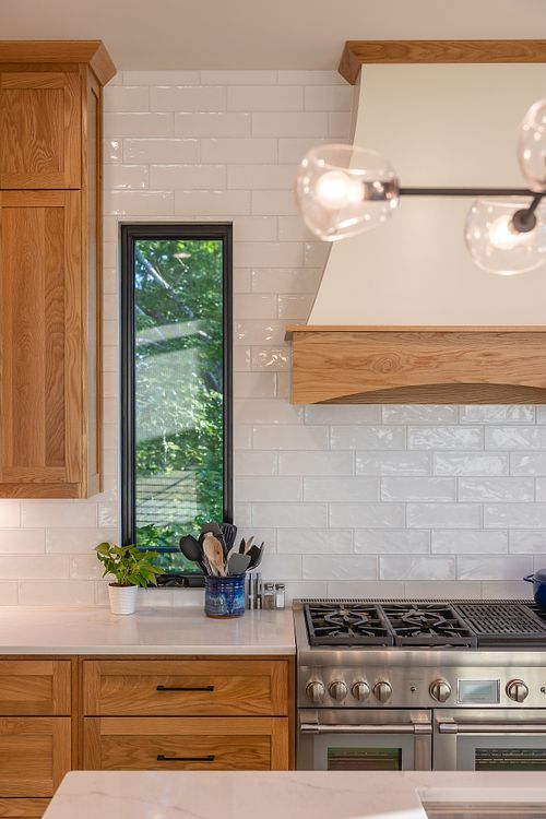 straight on view of narrow window that frames the view of the gas range