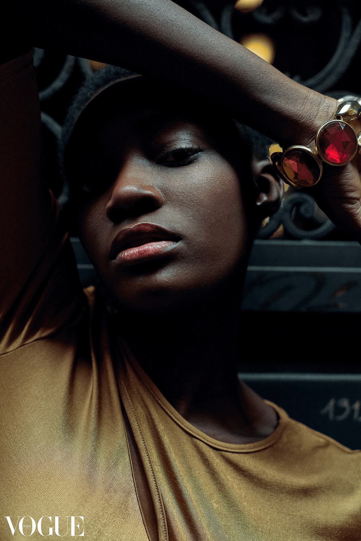 Beauty portrait of an afro woman in warm colours shot by Gabriel Matula.