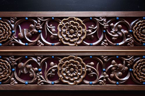 hand-carved rose and vine panel with liturgical violet background