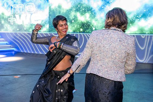 Shreya Krishnan dances on the main stage during the Grace Hopper Celebration 2024, showcasing leadership, energy, and inclusion at a major tech event.