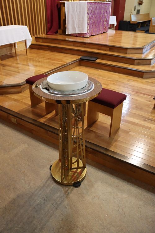 a picture of the mid-century modern baptismal font that the new hand carved font will replace