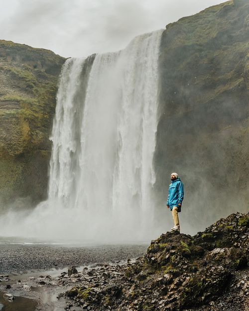 Male portrait by Skogafoss waterfall in Iceland